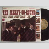 nw001409 (THE MERRY GO ROUND — The Merry-Go-Round)